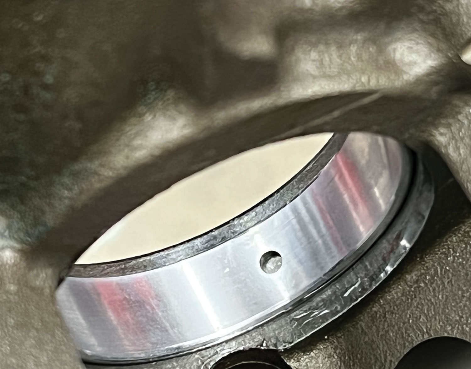 close view of a purposefully improperly installed cam bearing