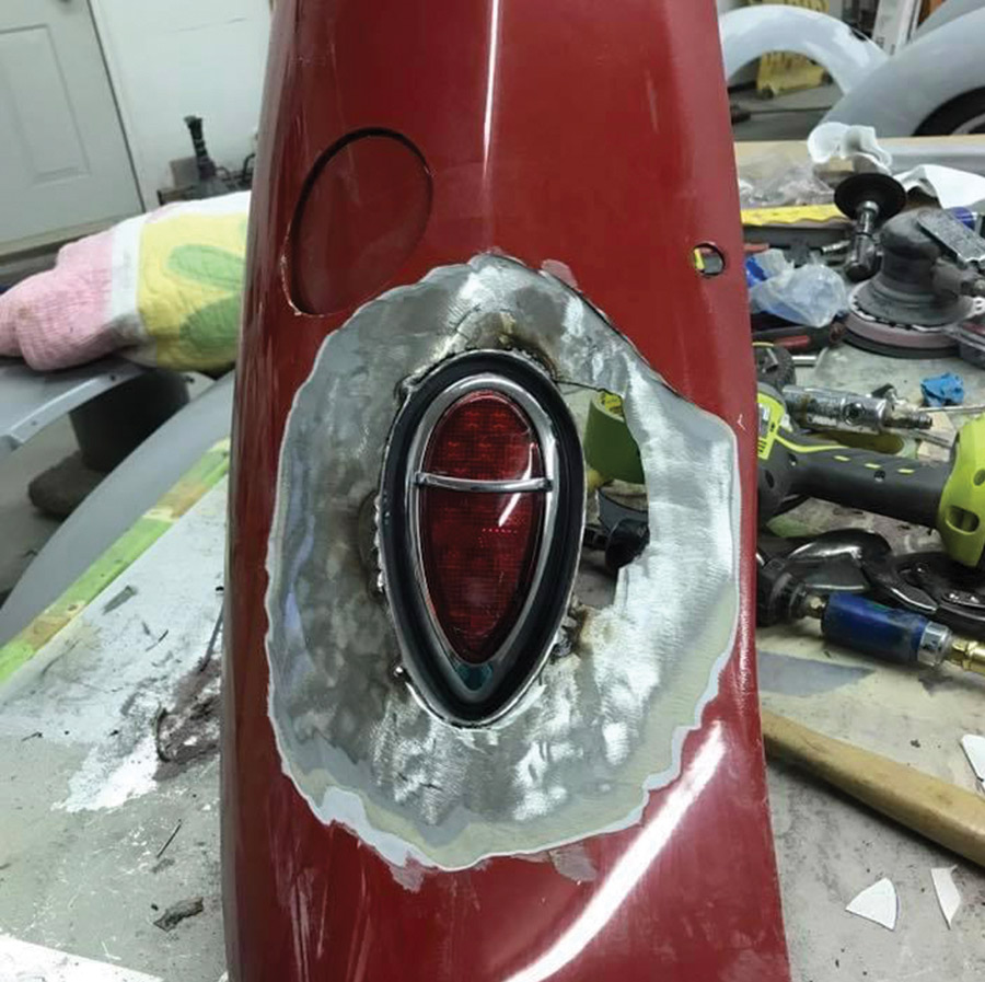 taillight bucket trimmed to the surface of the fender with the light temporarily bolted in place