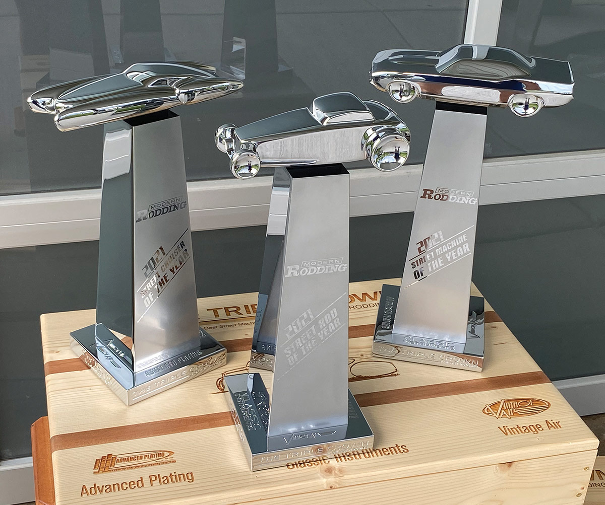 Modern Rodding Street Cruiser, Rod, and Machine of the Year awards displayed on top of a wooden crate