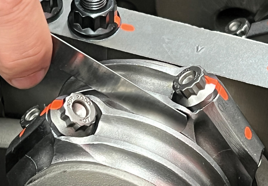 Martelli checks the connecting rod side clearance using a feeler gauge