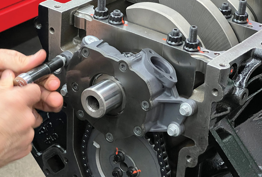 Martelli aligns the pump with the crankshaft by tightening the fasteners slightly snug