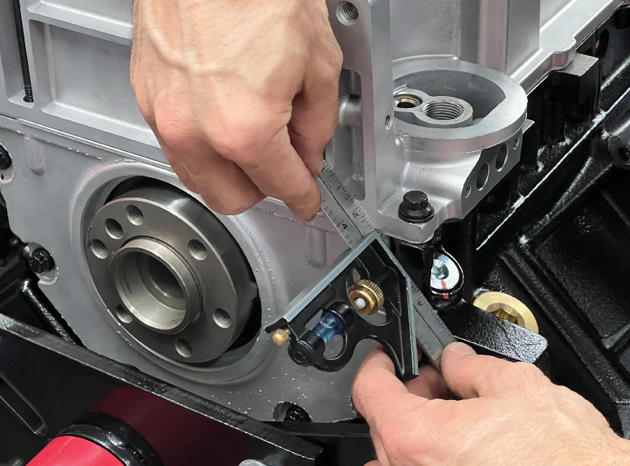 Using a straightedge, Martelli ensures that the back of the pan and block are aligned since some bellhousings/transmissions bolt to both surfaces