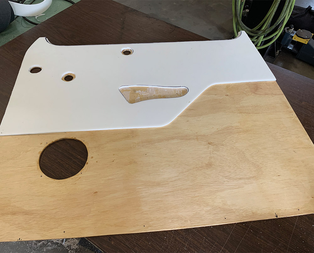 Non pleated portion of wood door panel covered in foam padding