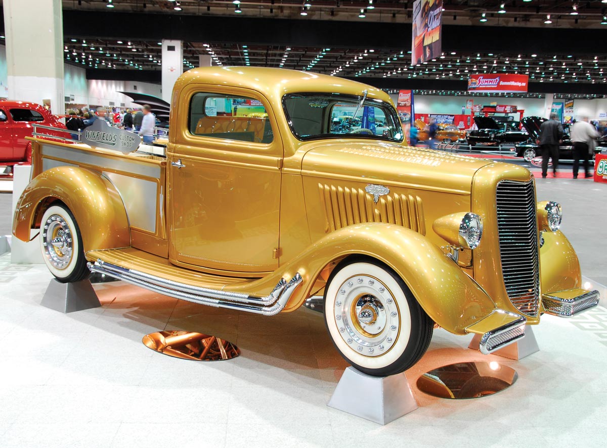 A gold 1935 Ford pickup truck