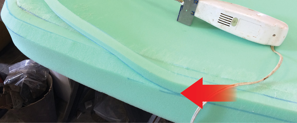 An easy way to trim foam is with an electric carving knife. Note the marks on the foam (arrow) that show the area to be trimmed.