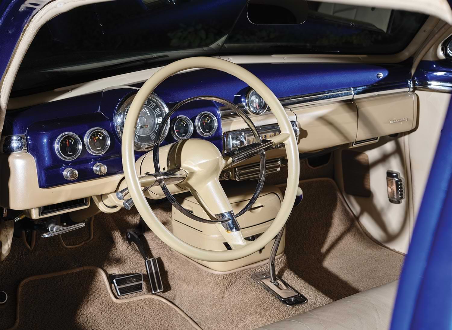 drivers side view of the '50 Merc steering, dashboard and driver and passenger footwells