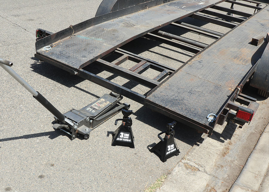 Harbor Freight 2-ton low-profile floor jack in front of the frame