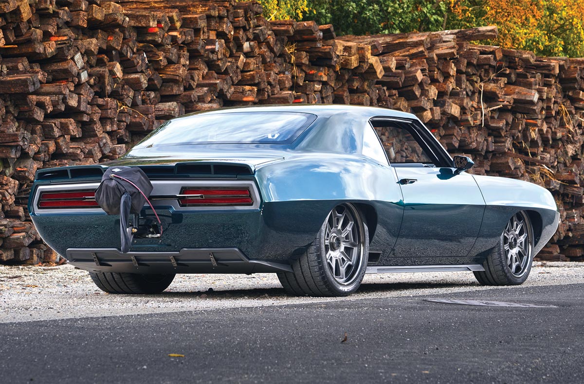 Rear right 3/4 shot of Firebird with drag chute in front of lumber