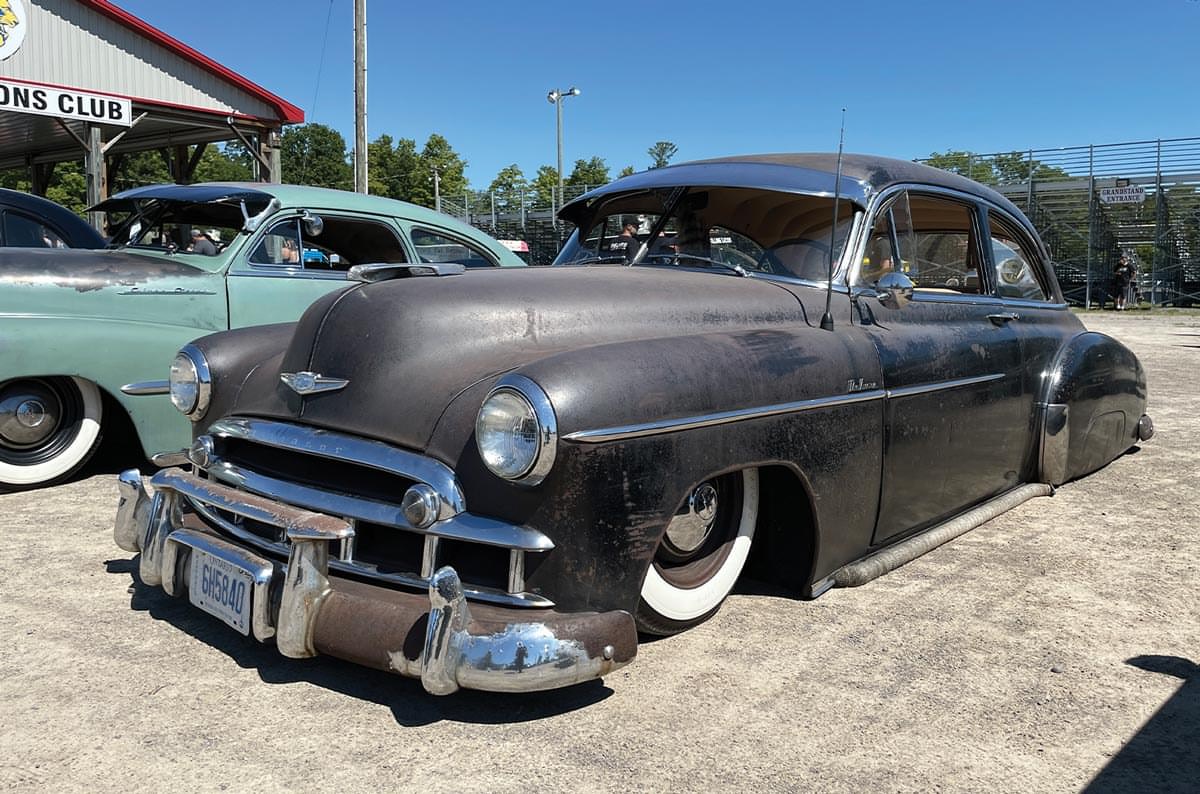 a heavy black patina 49 Chevy DeLuxe coupe