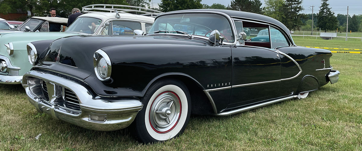 a black ’56 Olds Holiday 88