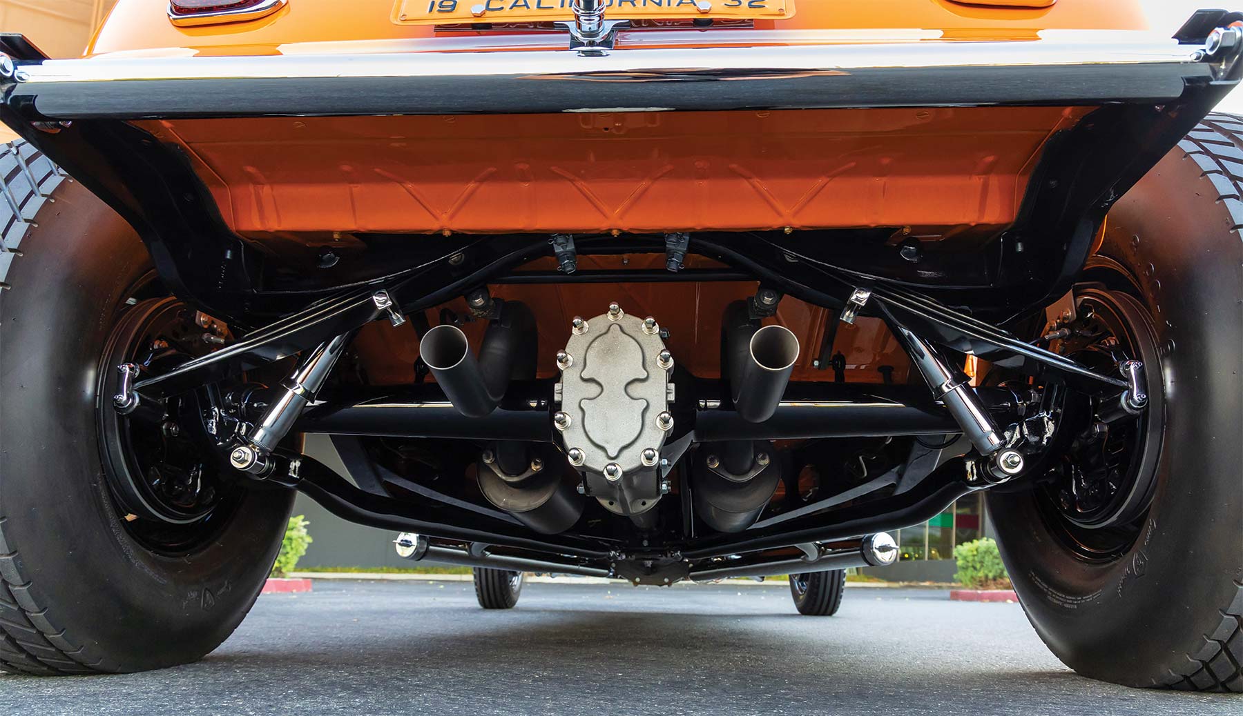 Rear view of undercarriage showing exhaust and axle assembly