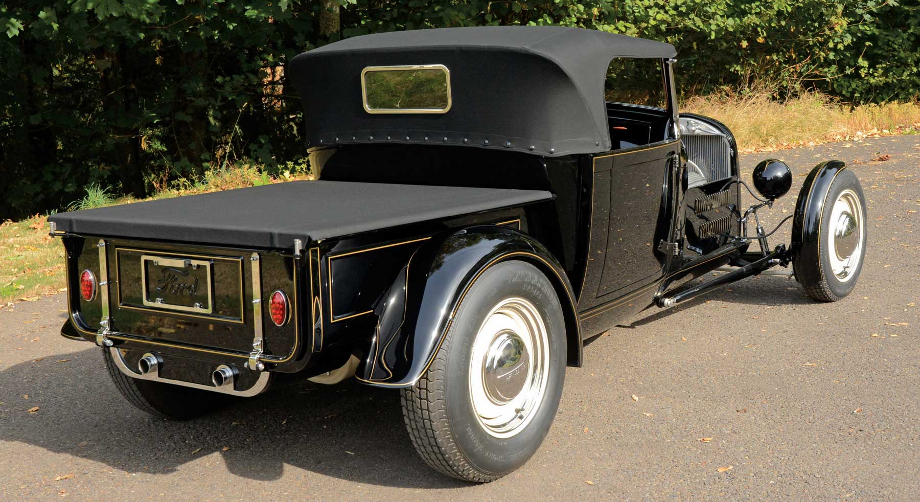 Rear view of '29 Ford with, gold pinstriping on fender edges and raised trim on bed