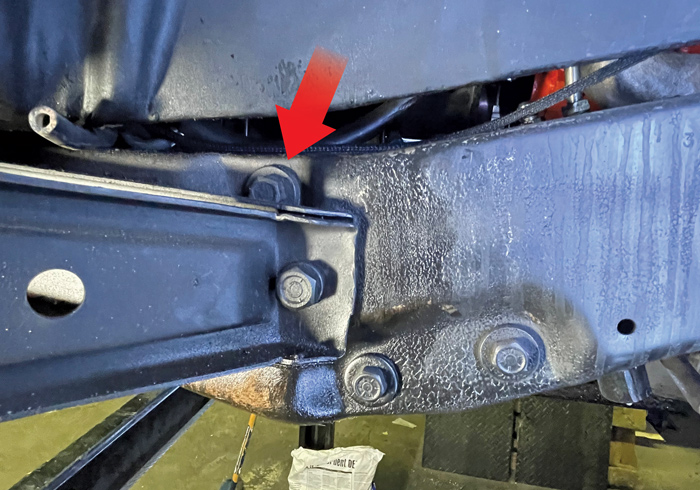 red arrow pointing to designated bolt