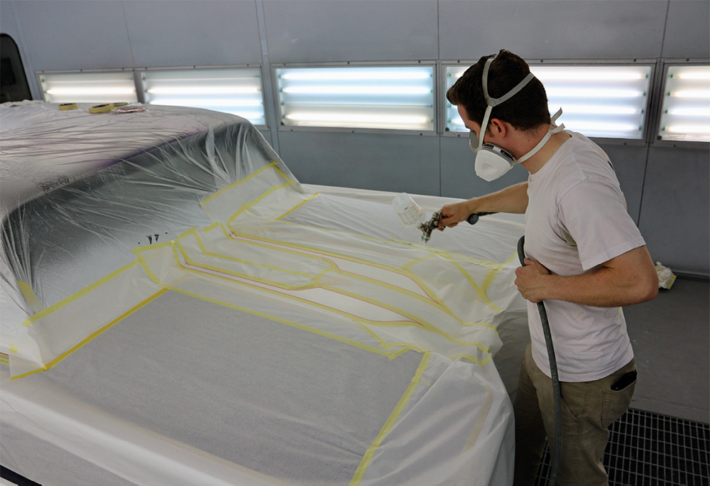 Spraying unmasked portions on trunk lid