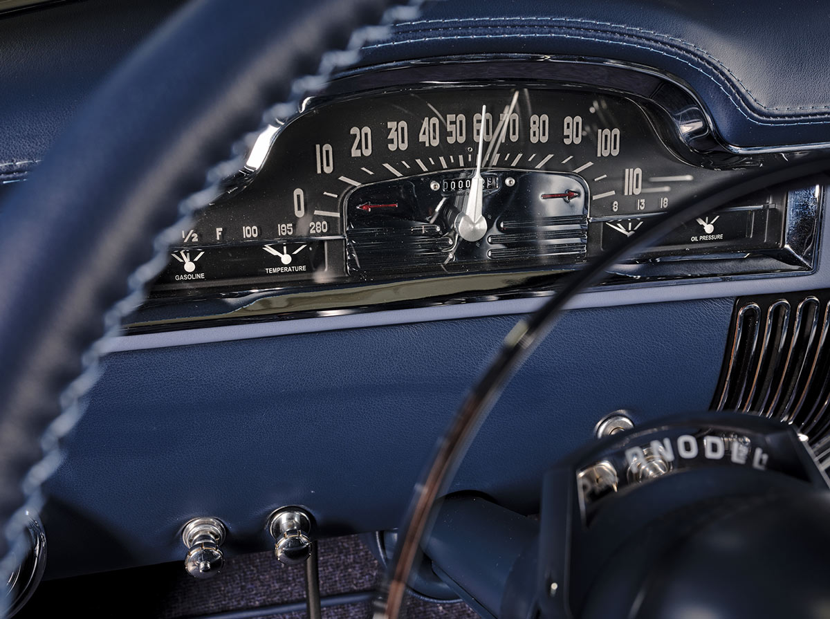 close view through the steering wheel of the ’49 Cadillac Series 62 Sedanette's dashboard gauges