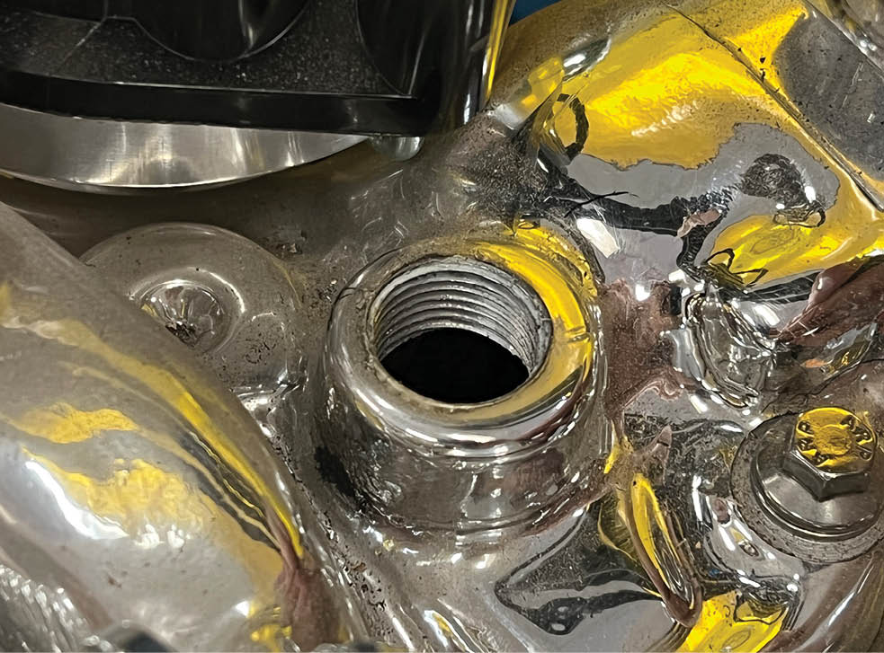 This is the pressure side fitting point on the intake manifold near the thermostat where the water leaves the engine and heads to the heater itself.