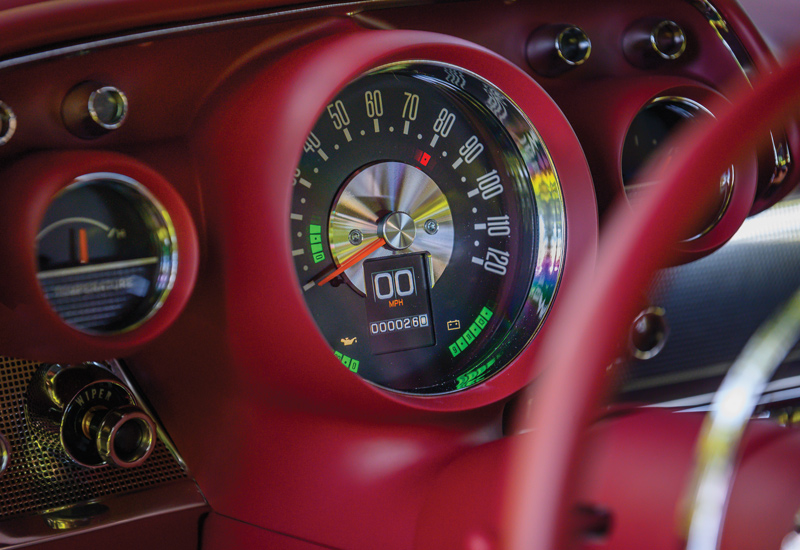 red steering next to speedometer