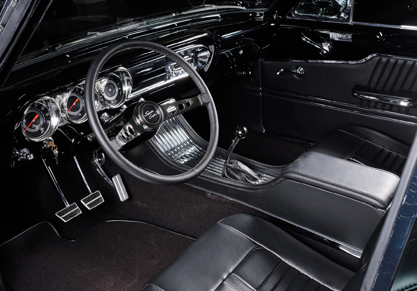 all black interior wheel view of '63 Ford Fairlane