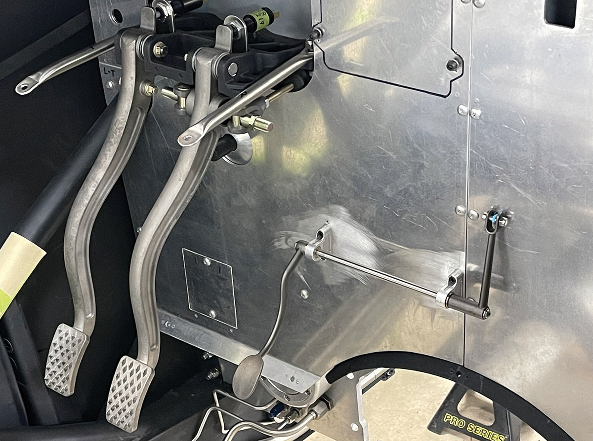 Activating the master cylinders are custom investment stainless steel cast brake and clutch pedals. The dual brake master cylinders are activated by a balance bar that allows brake bias to be adjusted. The throttle pedal is also cast stainless.