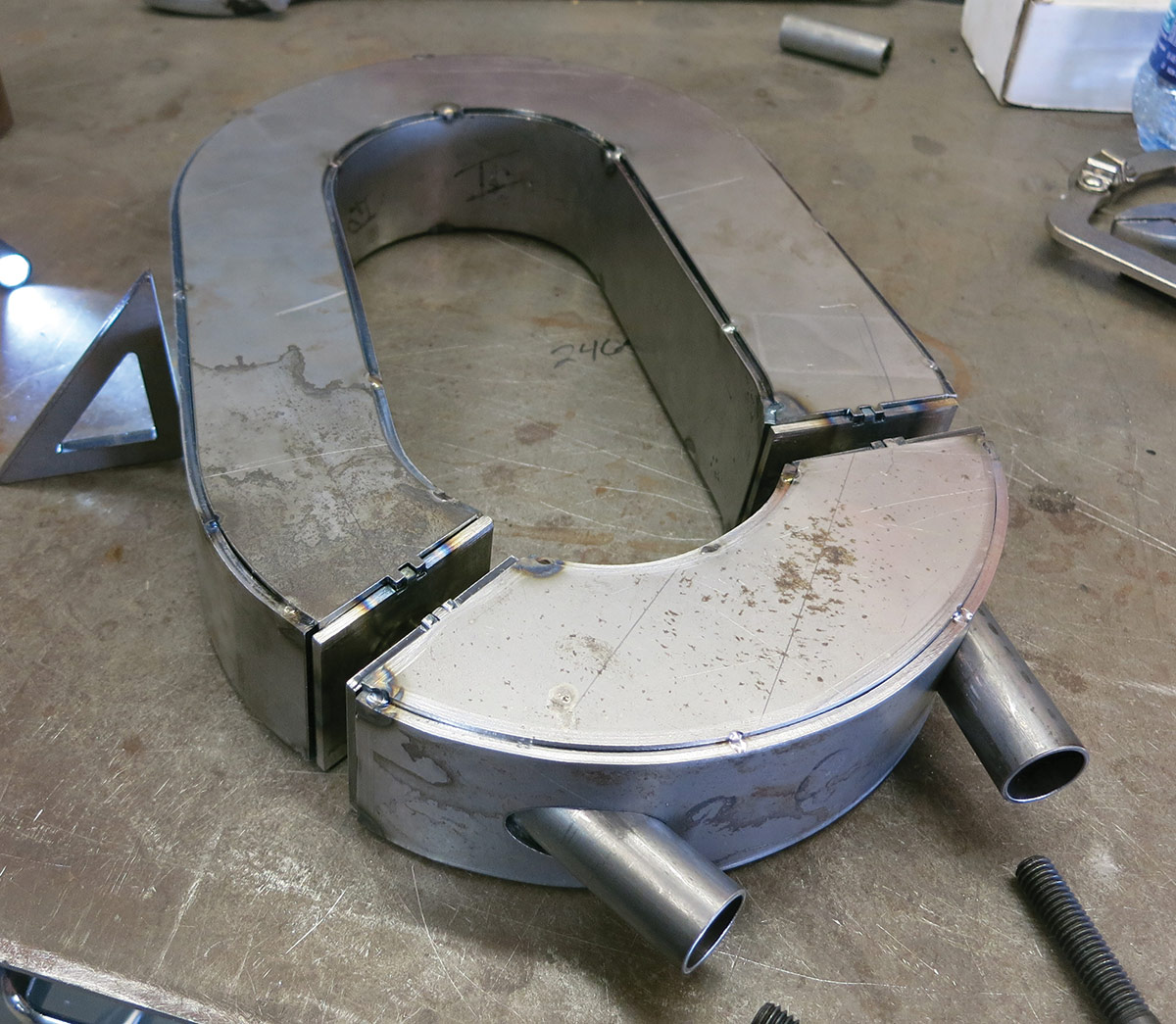 Rather than a simple C-notch, the rear of the frame was modified with a two-piece hoop on each side. The bottoms of the hoops are removeable to allow the rearend to drop out if necessary.