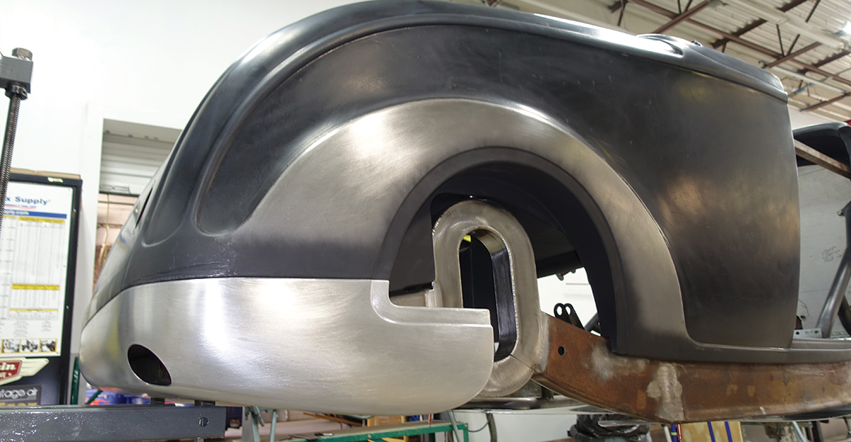 The beautifully crafted rear roll pan by Damon Detmer hides the torsion bar arms and blends into the wheelwell insert and bellypan that is yet to be installed.