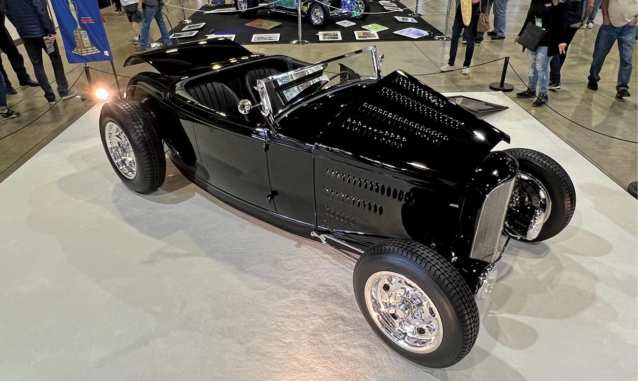 three quarter passenger side view of a black '32 Ford roadster