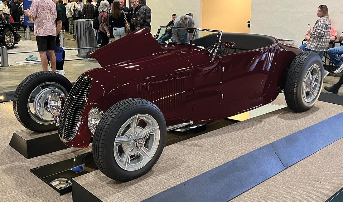 three quarter drivers side view of a deep burgundy cabriolet ’27 Ford lakes-style roadster