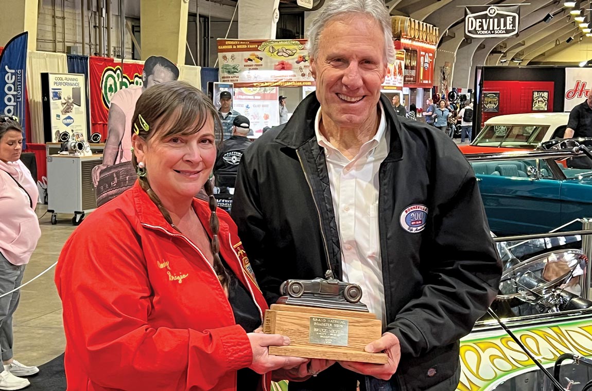 Bruce Meyer presenting Terri Hollenbeck with the Hot Rod Preservation Perpetual Trophy