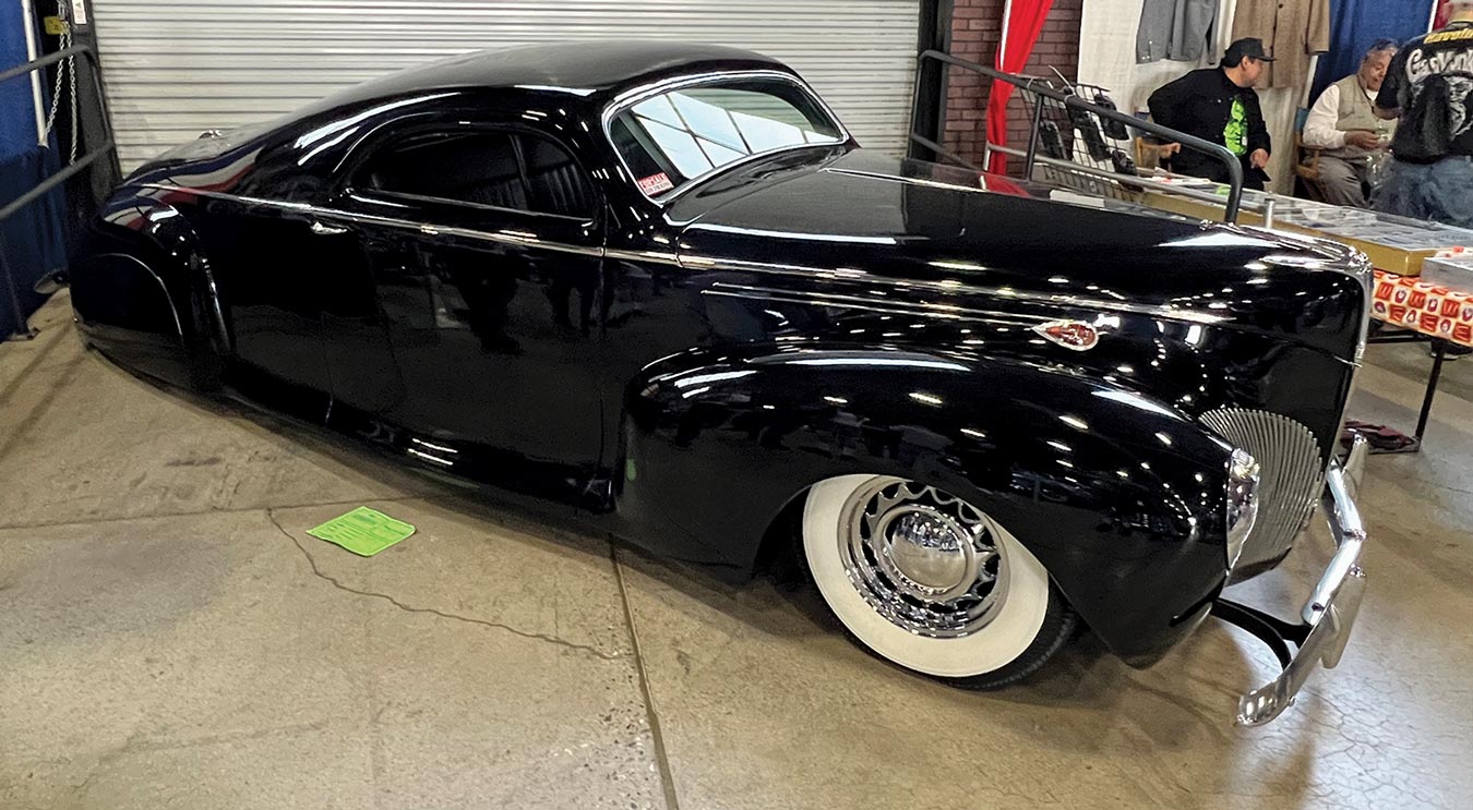 three quarter passenger side view of a glossy black ’40 Lincoln Zephyr