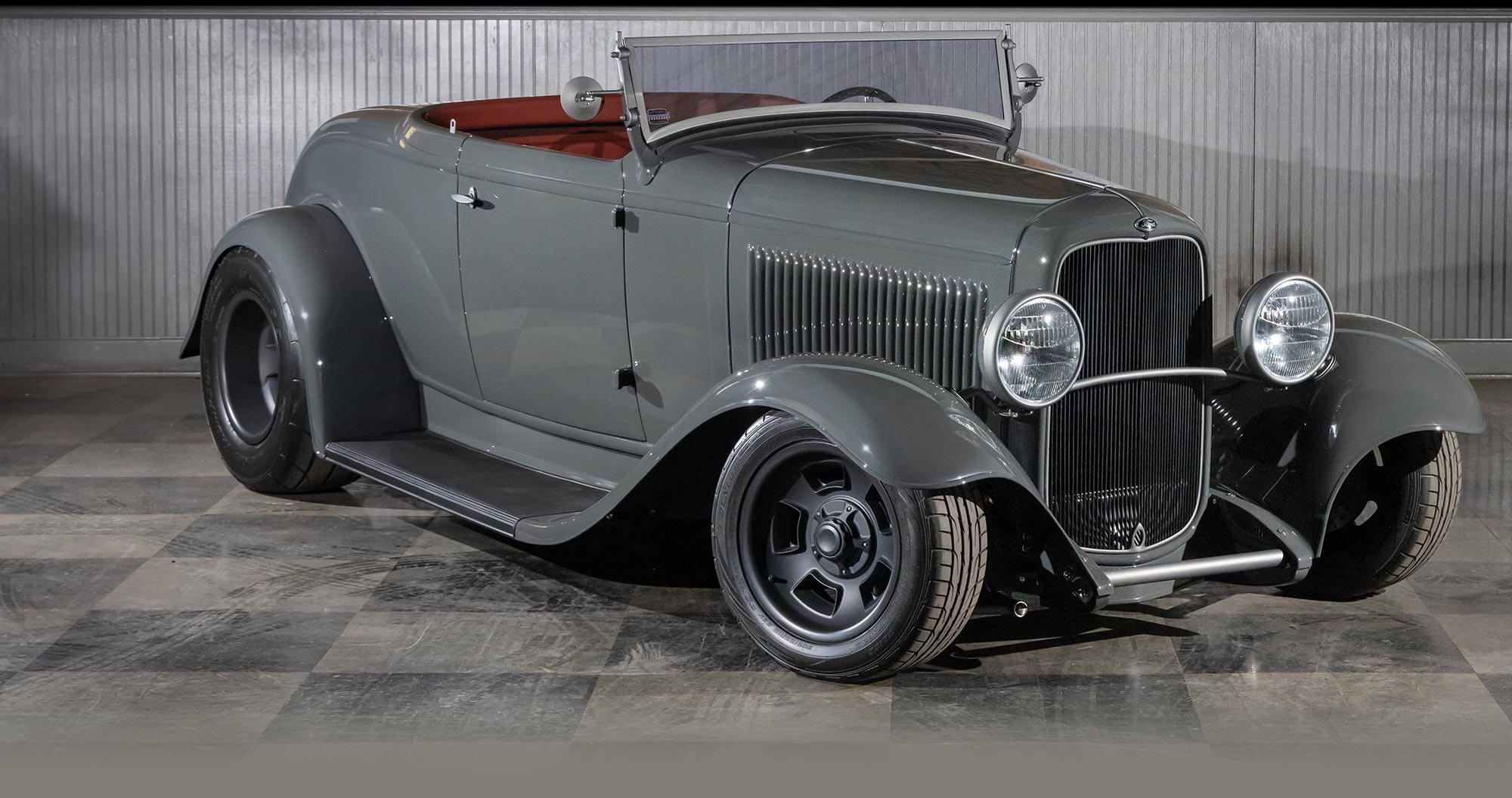 three quarter passenger side view of the gray ’32 Ford roadster