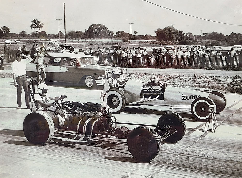 Vintage photograph of dragsters at staging line