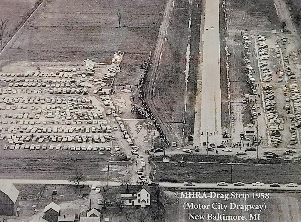 Aerial view of MHRA drag strip in 1958 with full parking lots