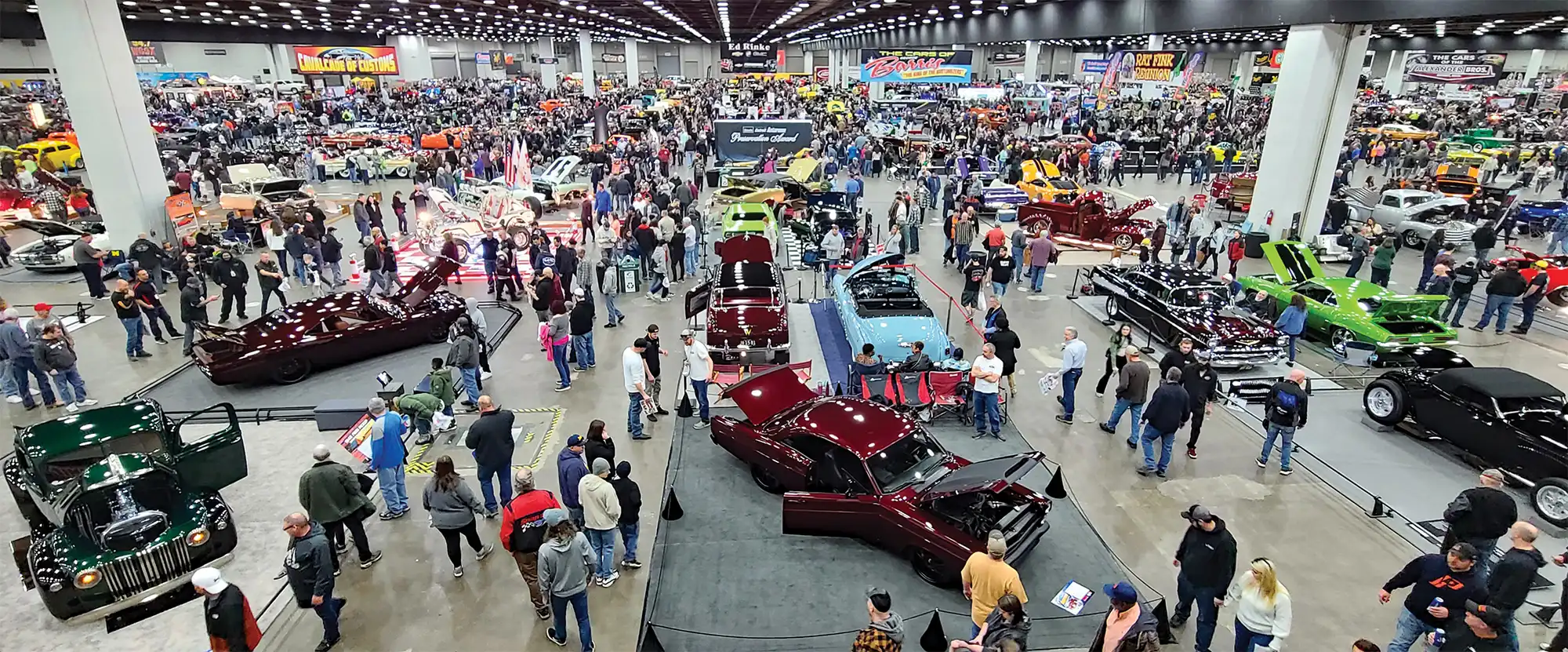 Show floor filled with cars and attendees