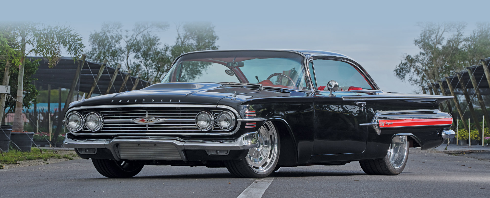 '60 Impala in Black and Red with powder blue sky behind