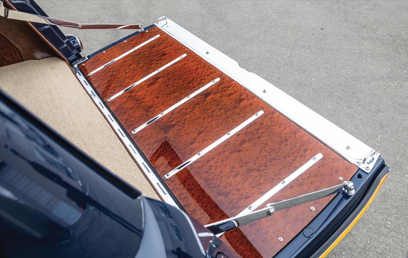 close up of the '50 Ford Woodie's bottom tailgate lined with a pommele sapele wood panel