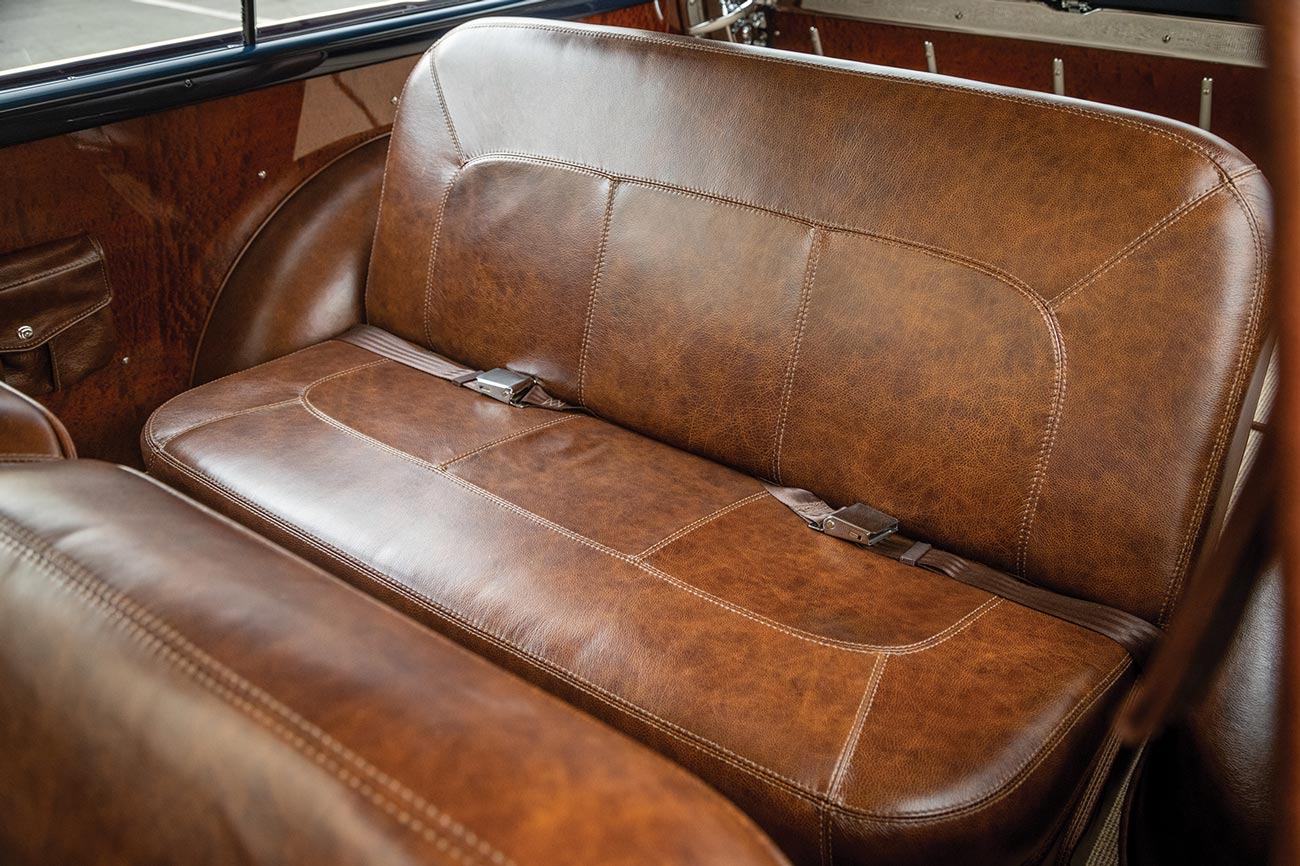 '50 Ford Woodie's rear seating covered in distressed brown leather