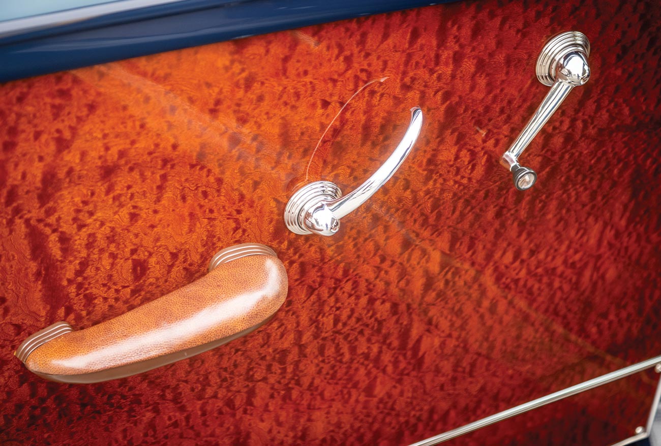 close up of the pommele sapele wood paneling inside the '50 Ford Woodie's driver side door