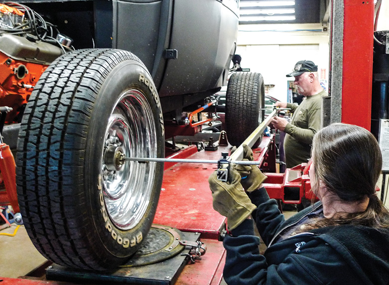 Before we ever started, wheel alignment was good. Now that it’s centered side-to-side, Mr. Greene and Mrs. Rotten employ Auto Shop’s tram bar to square the fresh rearend.