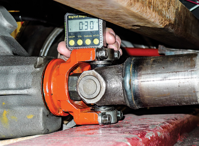  Here a small magnetic angle finder is handy. For an equal opposite of the transmission tailshaft angle, we’ll keep trying for 2 degrees up at the pinion.