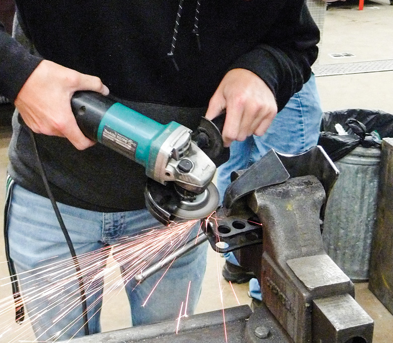 Our test-fit was tight, so for an ounce of prevention, Derek is grinding his notch a couple tads wider. This way, when it’s time for bounce-testing, we’ll know it’ll pass.