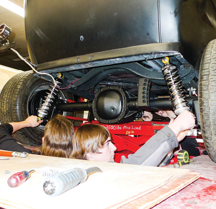 Toward the end of this chapter, Brock and Mason reinstall the coilovers—in a proper up-side-up fashion this time around.