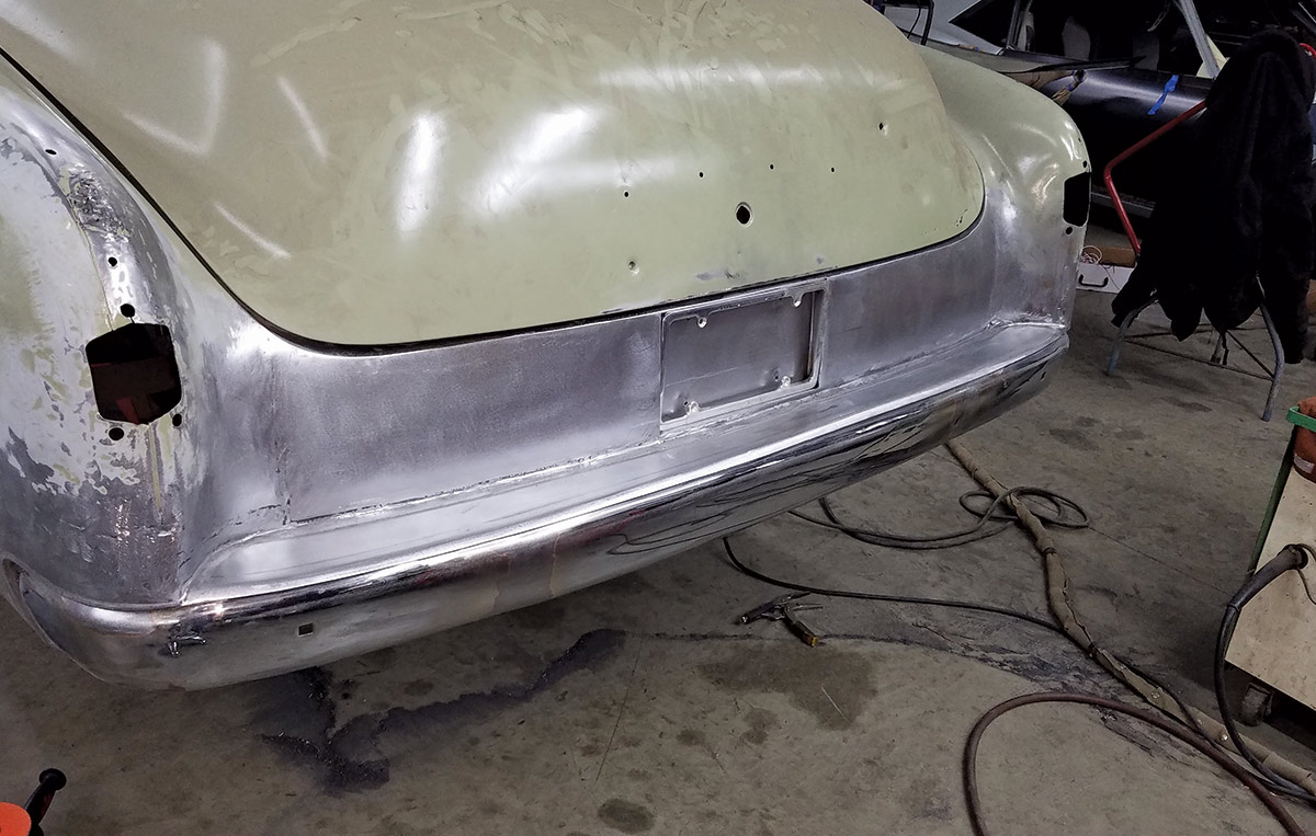 Here we can see the custom pan formed to meet the tucked bumper. The panel between the rear fenders was replaced with a custom panel that includes a frenched license plate opening.