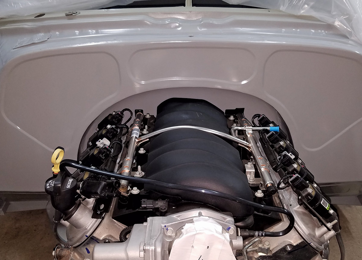 A stock LS3 Chevrolet engine resides in front of the custom-formed firewall. A custom engine cover is planned with ’55 Chevy influence. A 4L65E transmission passes power back to the 9-inch rear.