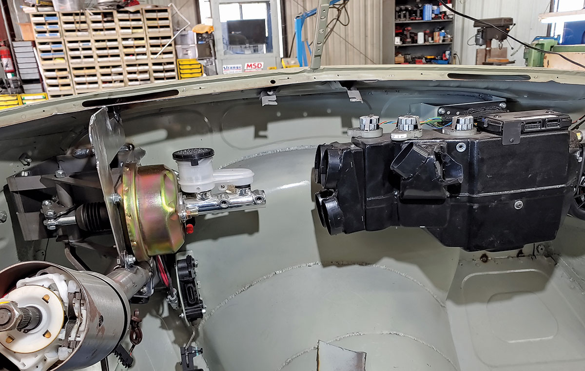 The original dashboard would be extended 3 inches to make room for goodies like the power master cylinder, electronic throttle, Flaming River electric power steering, and the Vintage Air unit.