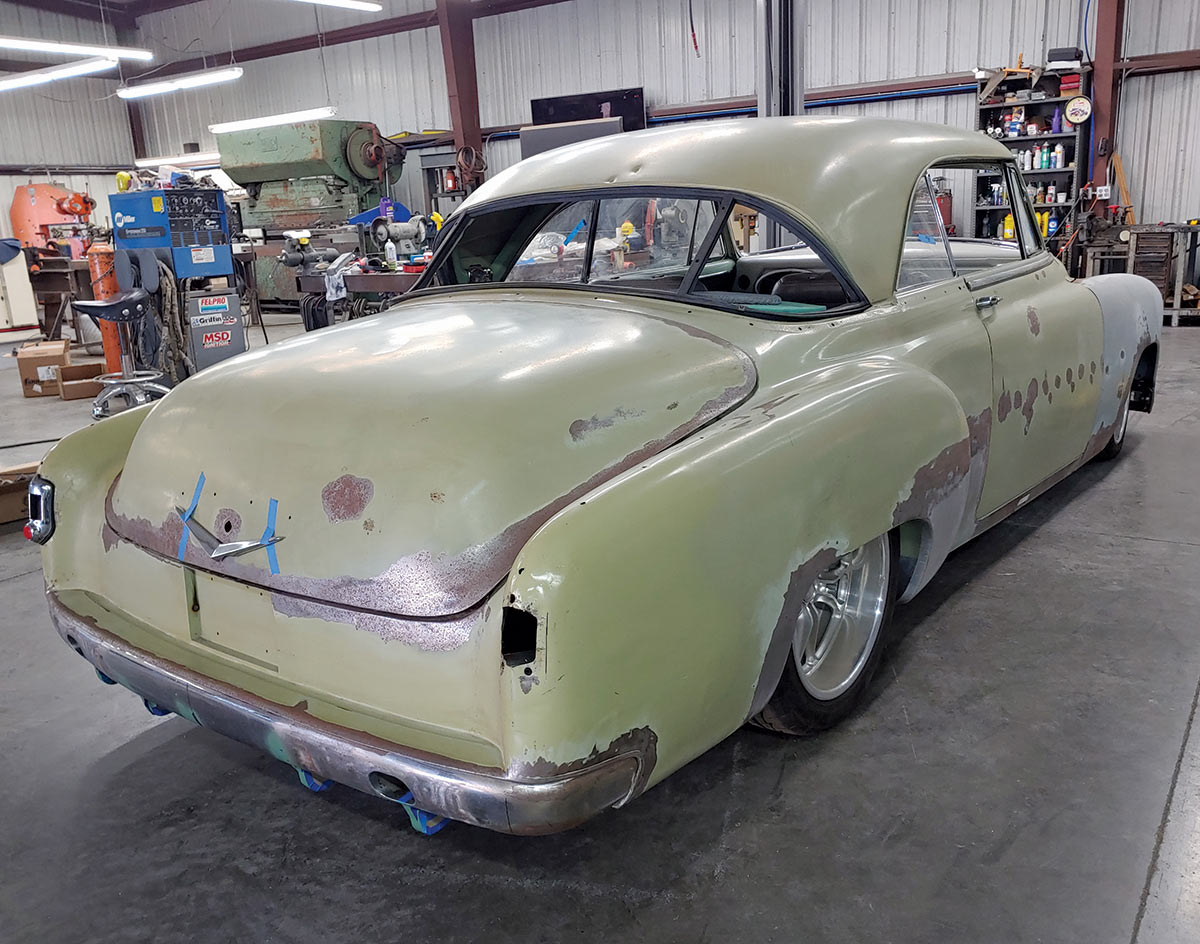 Rear side angle view of the original silhouette of the ’51 Chevrolet Bel Air car inside an auto shop area; Our parting shot, proving that coming or going to this Bel Air is going to be a great custom. Final paint- and bodywork will be handled by Jim Ramirez. Matus has not picked the colors yet, but he assures us it will be two-tone.