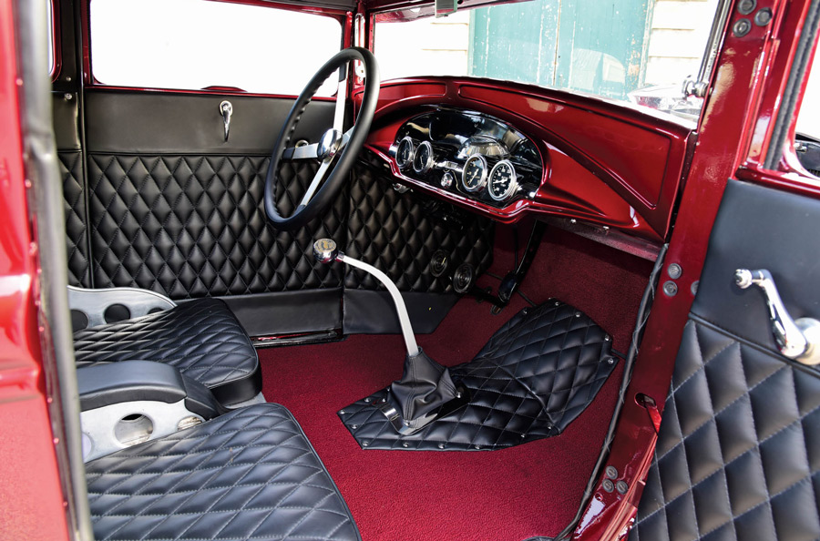 steering, dash, and black leather interior inside of a '30 Ford Coupe