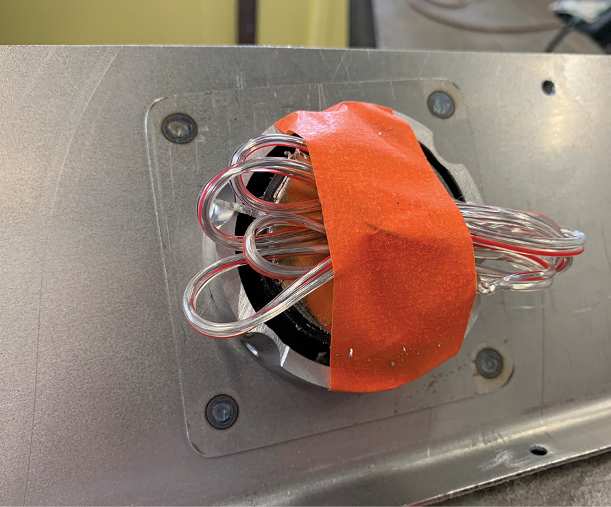 The speaker is now assembled with the cutdown bucket. Here you can see the four welds holding the extra layer of sheetmetal. The inner bucket and outer bezel are threaded for easy assembly.