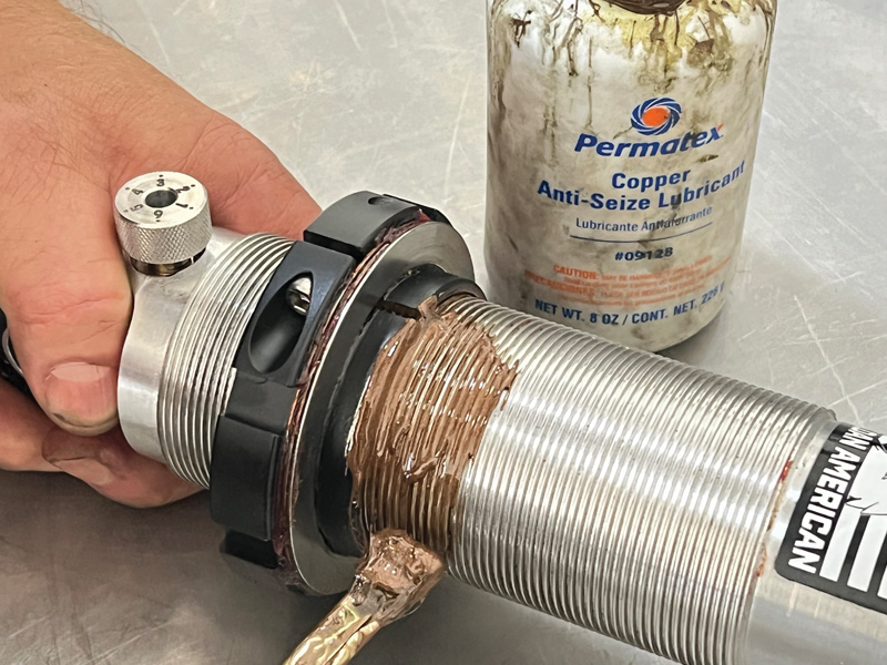 To prevent the threaded adjusters from galling on the aluminum shock bodies copper antiseize while wheel bearing grease is applied to the thrust bearing rollers.