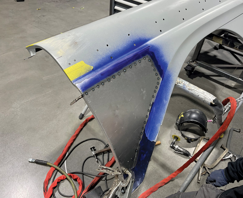 Most of the body was in good shape, but there were a few areas where patch panels were required. Here a large patch is being fitted to the front fender.