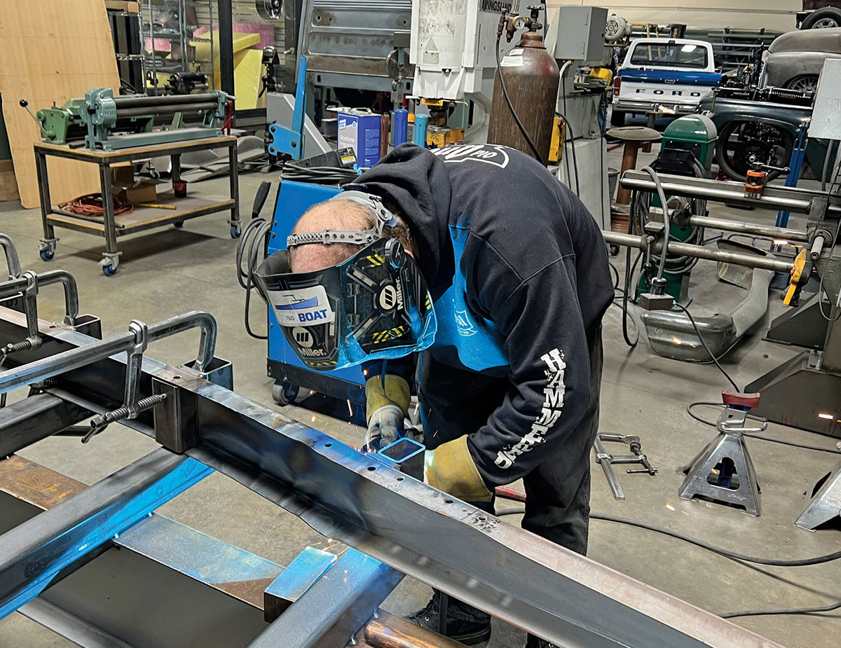 Once a section is shaped, an upright is welded to the frame jig to ensure nothing moves and the framerail is securely clamped in place.